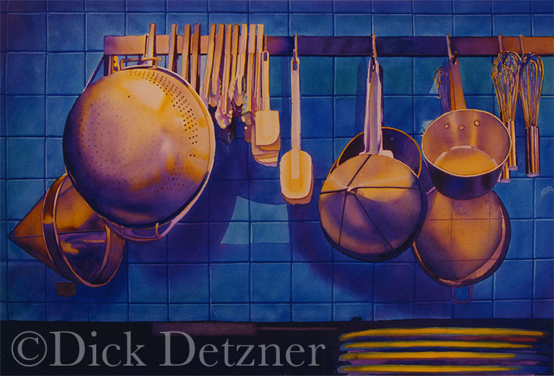 pots and pans hanging on a rack