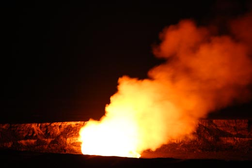 fire erupting from the mouth of a volcano